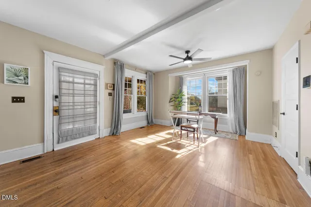 a view of a livingroom with furniture and a window