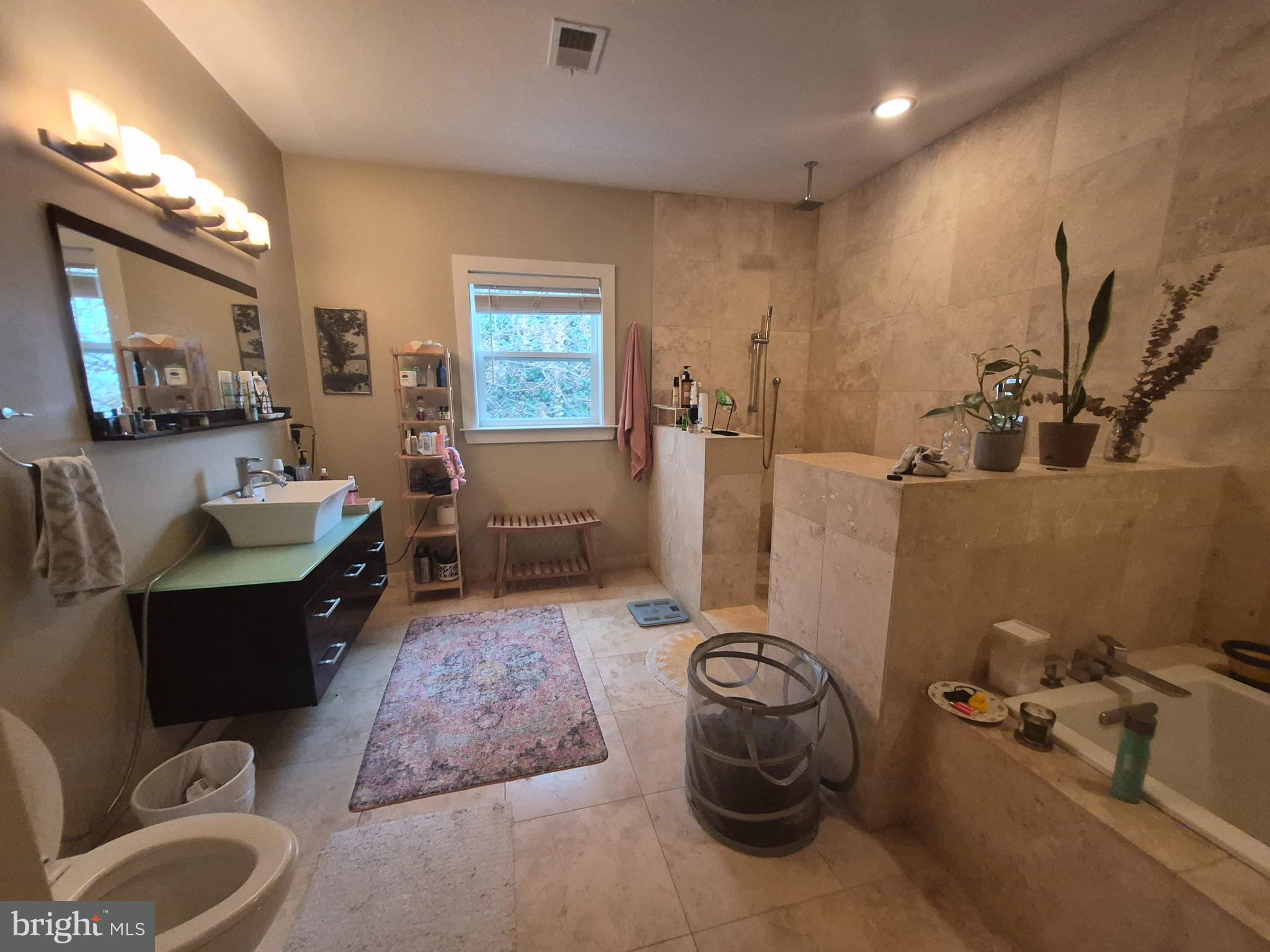 2544 Montrose Street Philadelphia, PA 19146 - Photo 14 of 23 a living room with furniture and a flat screen tv