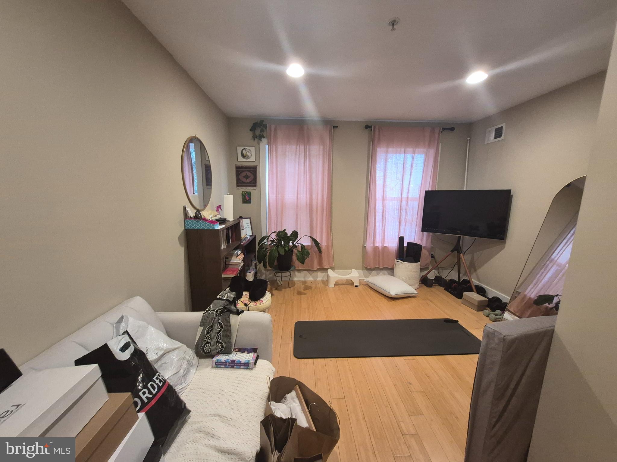 2544 Montrose Street Philadelphia, PA 19146 - Photo 7 of 23 a bedroom with a bed and a flat screen tv