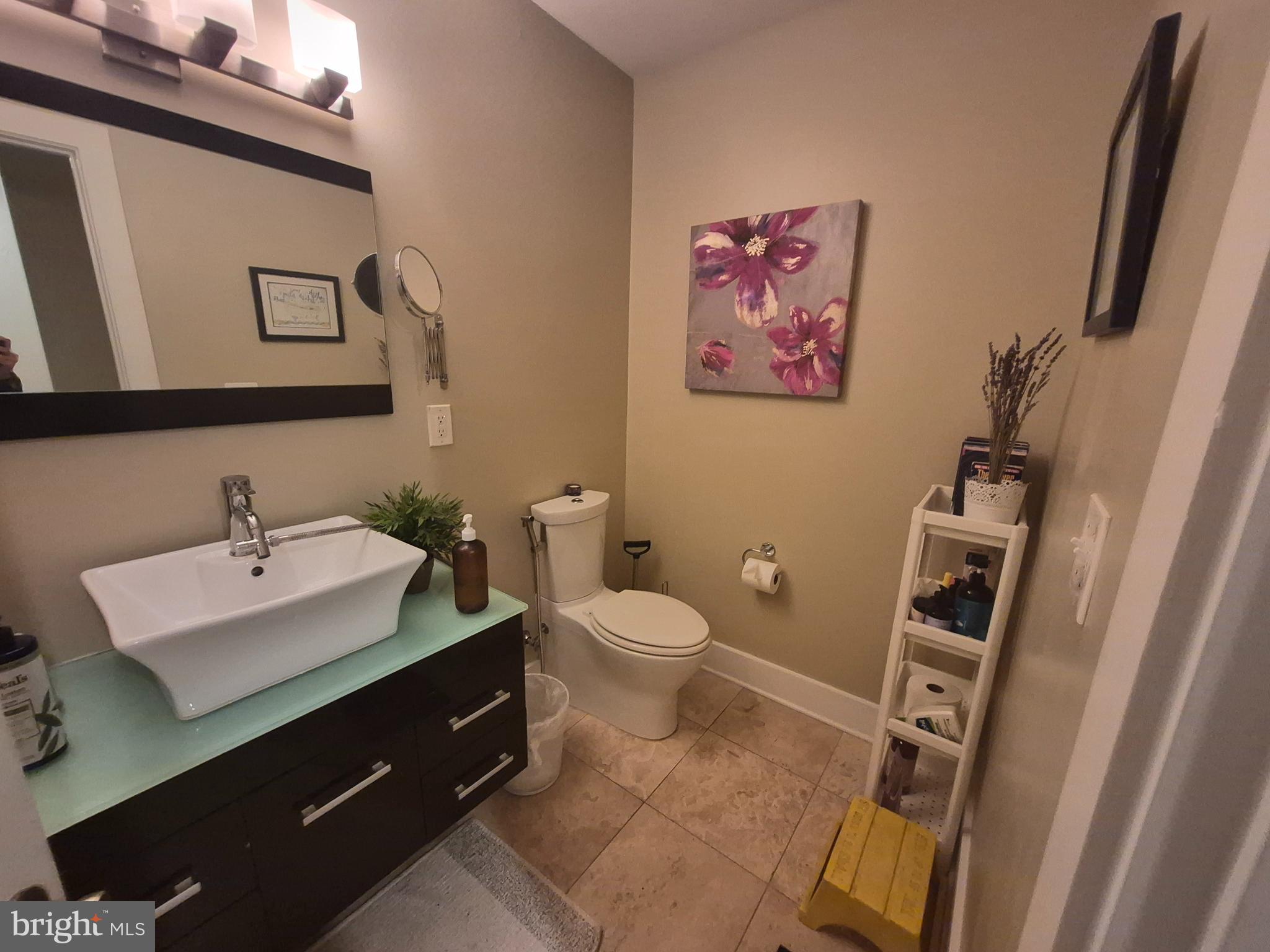 2544 Montrose Street Philadelphia, PA 19146 - Photo 9 of 23 a bathroom with a toilet a sink and mirror