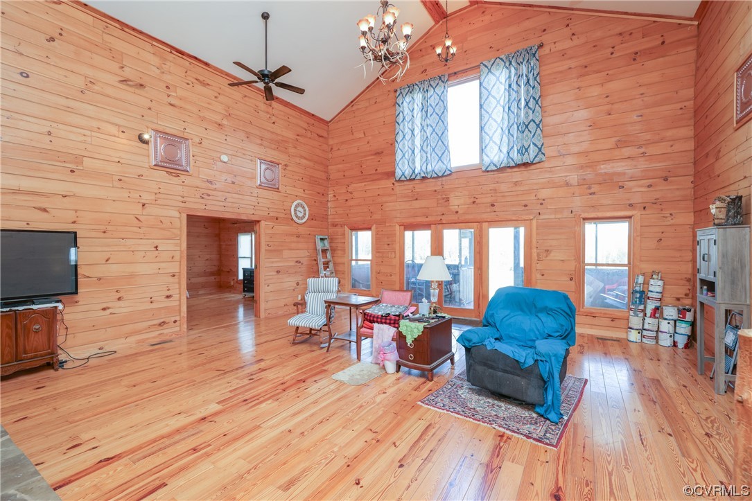 3913 Woodland Church Road Buckingham, VA 23921 - Photo 11 of 50 a living room filled with furniture windows and a flat screen tv