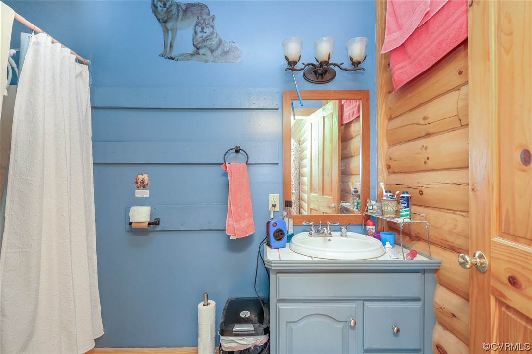 3913 Woodland Church Road Buckingham, VA 23921 - Photo 20 of 50 a bathroom with a sink and a mirror