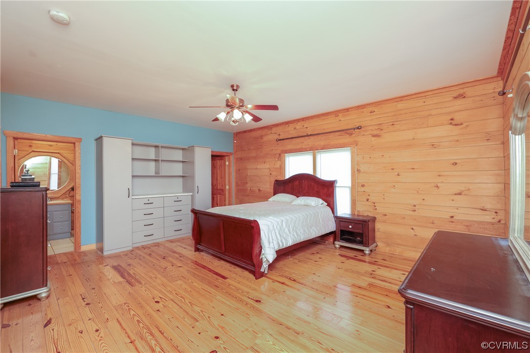 3913 Woodland Church Road Buckingham, VA 23921 - Photo 22 of 50 a spacious bedroom with a bed and a flat screen tv