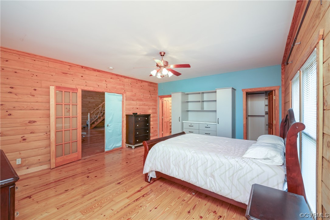 3913 Woodland Church Road Buckingham, VA 23921 - Photo 23 of 50 a bedroom with a large bed closet and a large mirror