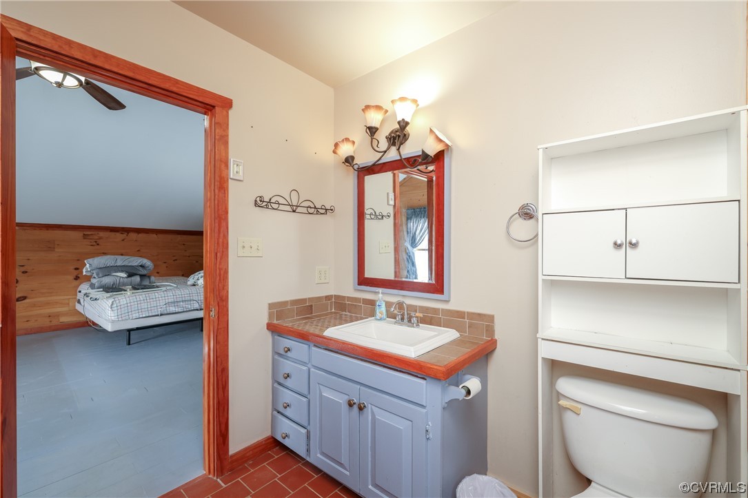 3913 Woodland Church Road Buckingham, VA 23921 - Photo 34 of 50 a en suite bathroom with a sink and a mirror