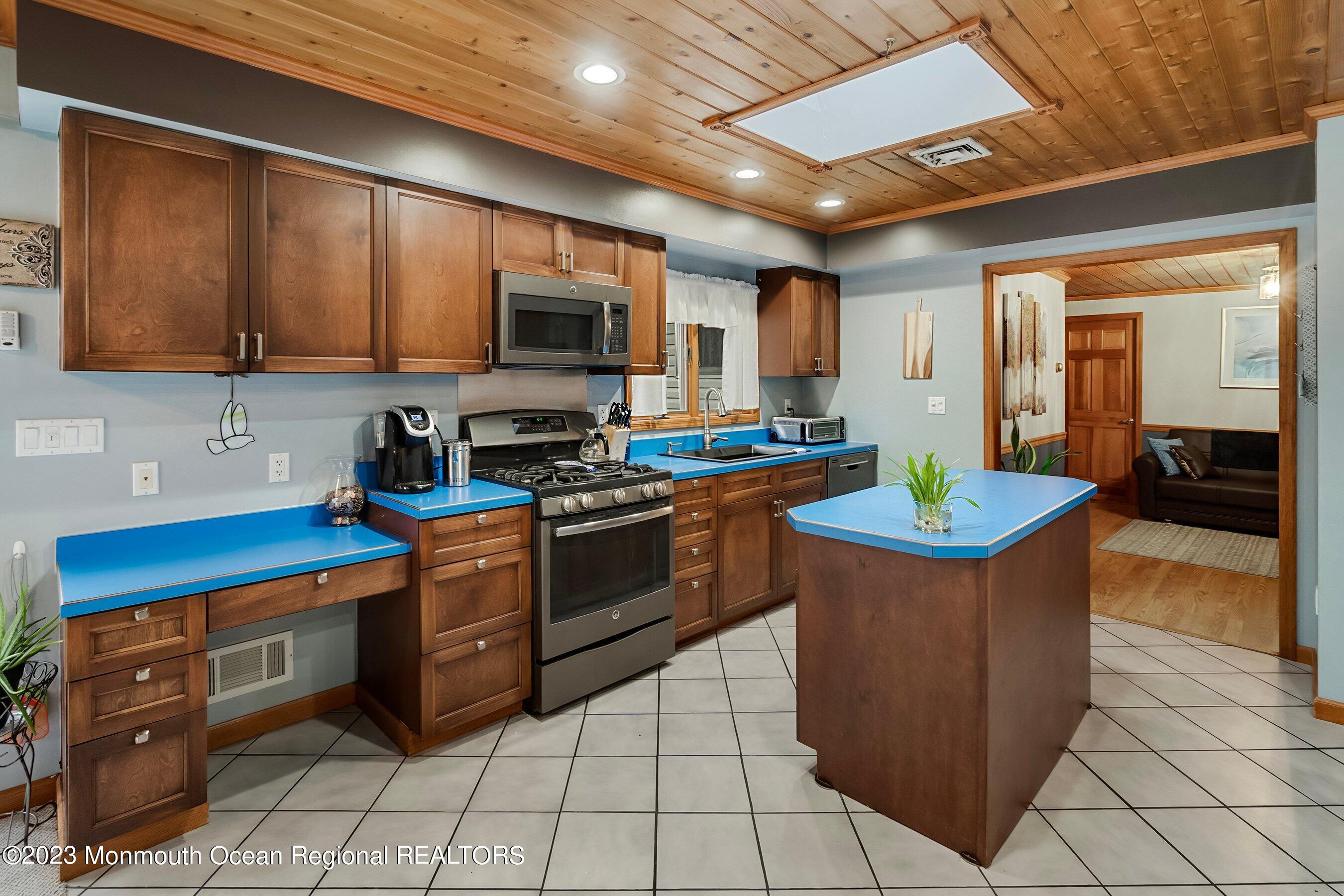 375 Cook Road Jackson, NJ 08527 - Photo 14 of 22 a kitchen with stainless steel appliances granite countertop a stove a sink and a microwave