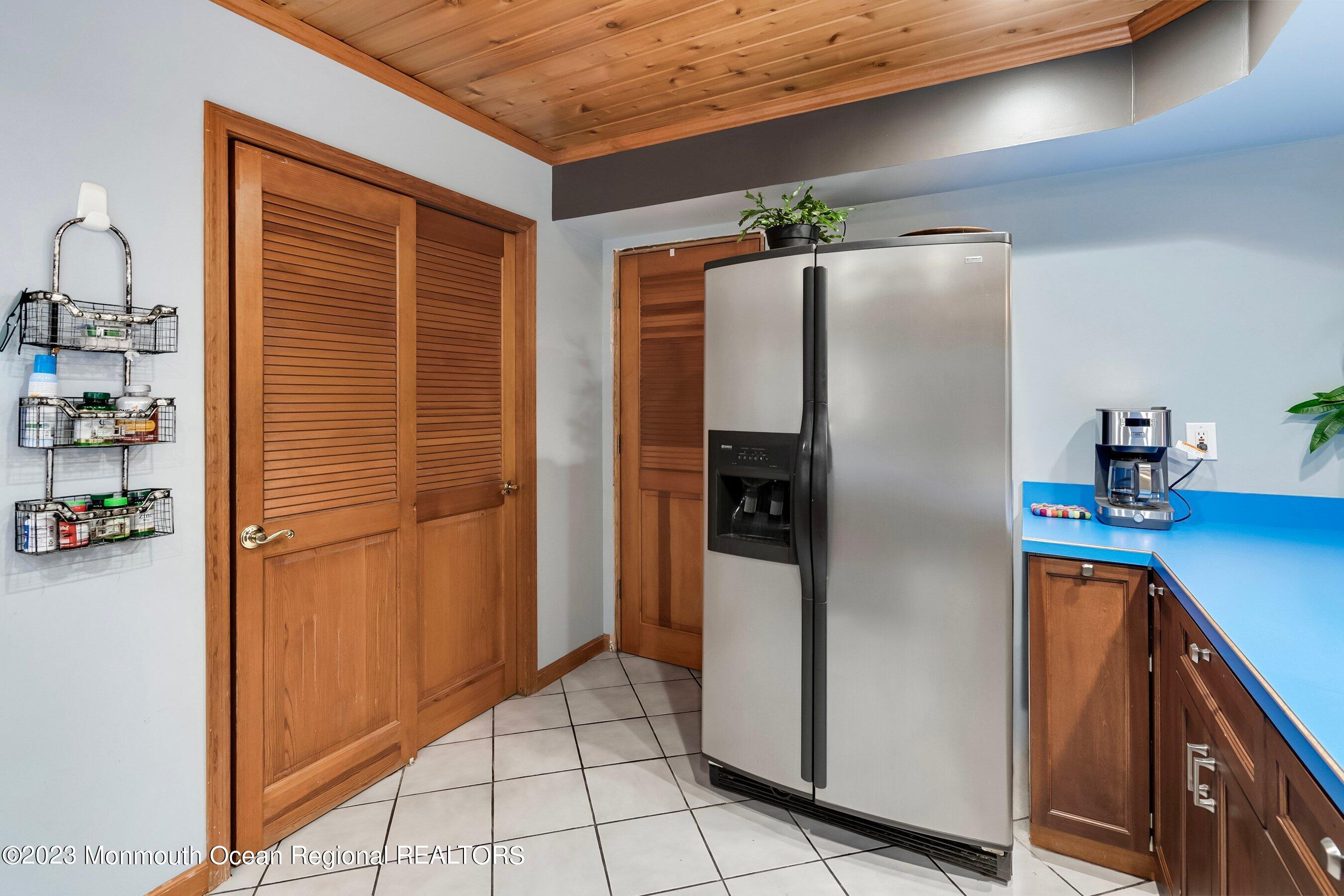 375 Cook Road Jackson, NJ 08527 - Photo 16 of 22 a kitchen with refrigerator and car parked