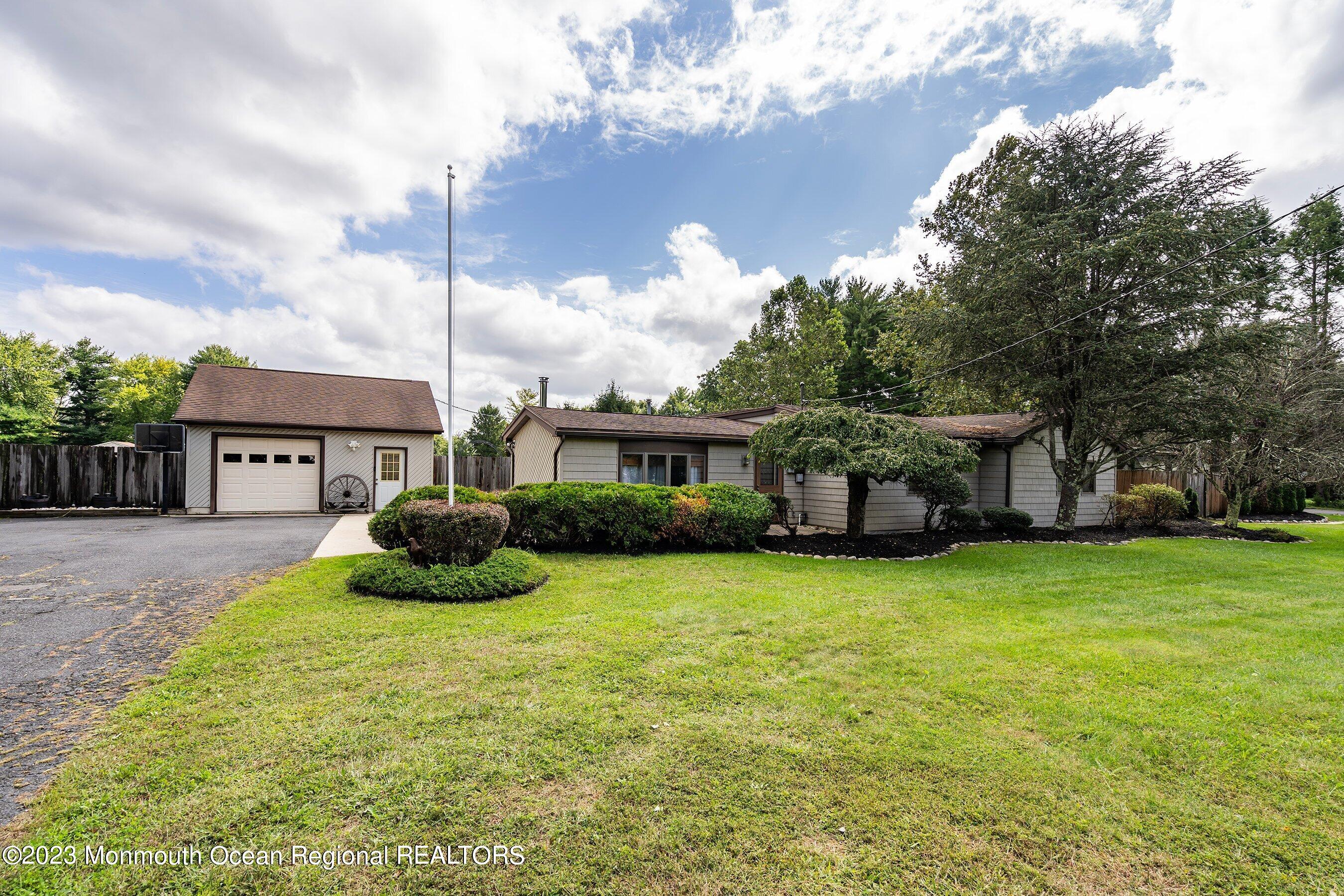 375 Cook Road Jackson, NJ 08527 - Photo 2 of 22 a view of a house with a yard and sitting area
