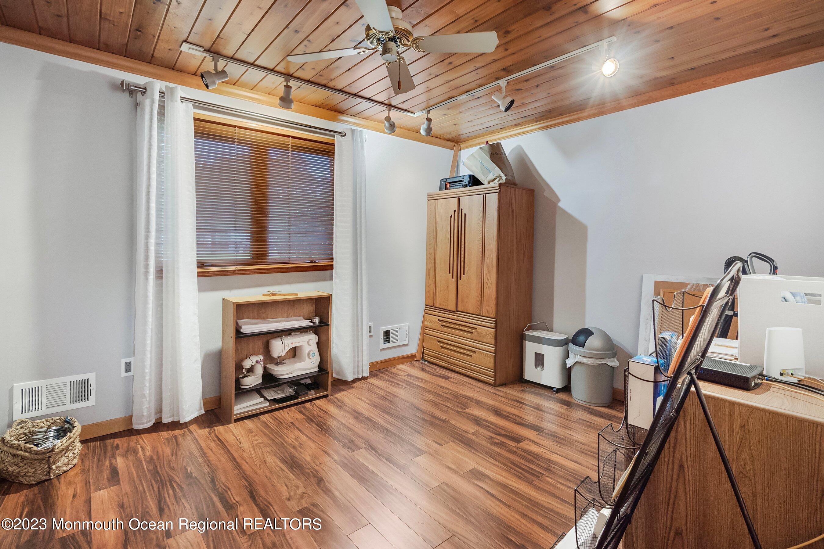 375 Cook Road Jackson, NJ 08527 - Photo 21 of 22 a view of a bedroom with a bed and wooden floor