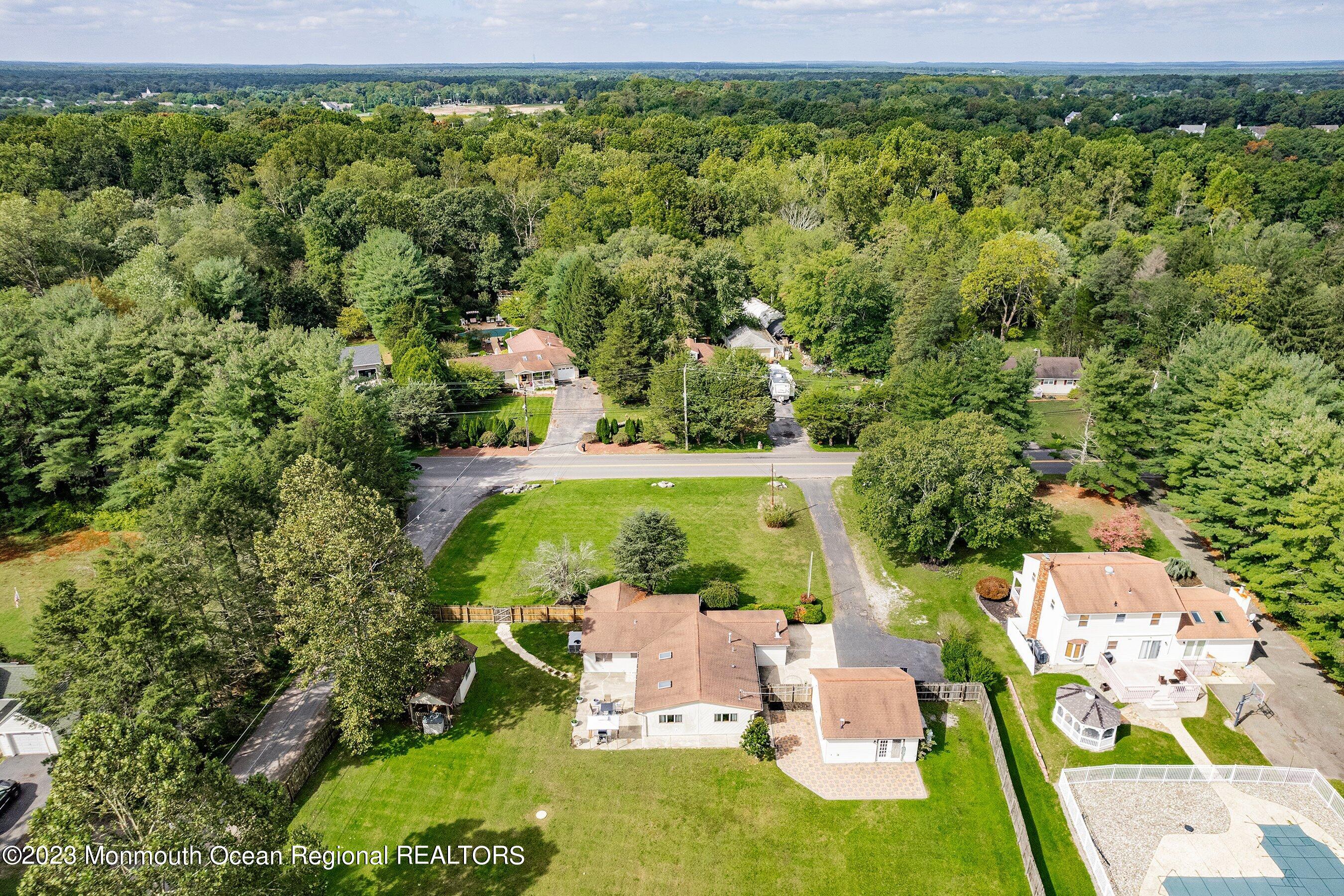 375 Cook Road Jackson, NJ 08527 - Photo 4 of 22 an aerial view of residential houses with outdoor space and trees