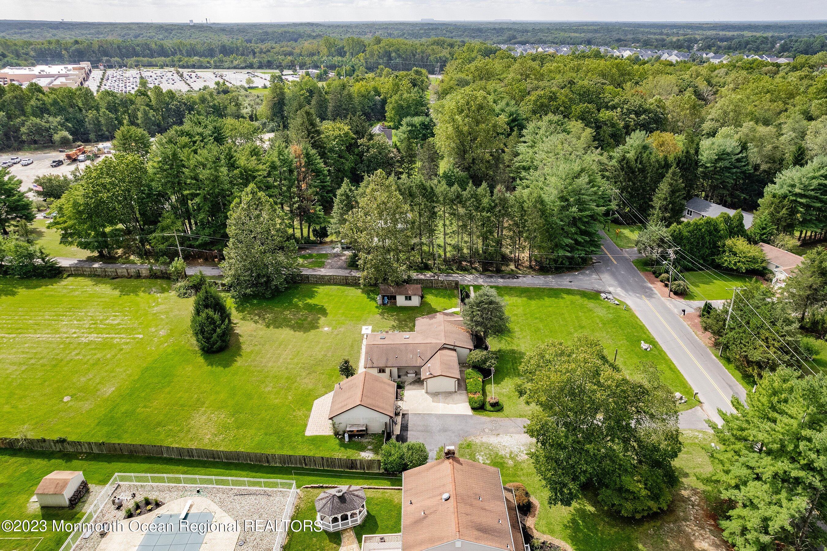 375 Cook Road Jackson, NJ 08527 - Photo 6 of 22 an aerial view of a residential houses with yard and swimming pool