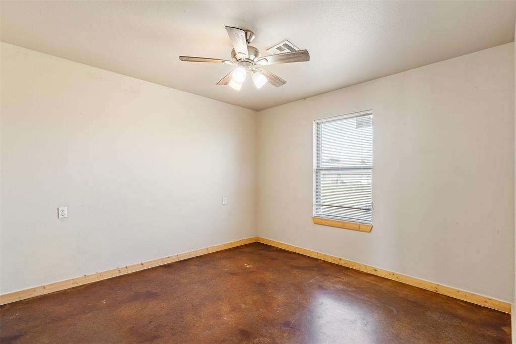13001 Owen Lane, Unit 13005 Thackerville, OK 73459 - Photo 11 of 15 Unfurnished room featuring finished concrete floors and ceiling fan