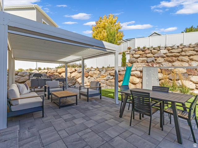 882 Spring Dew Lane Lehi, UT 84048 - Photo 23 of 46 View of patio with outdoor lounge area and a pergola