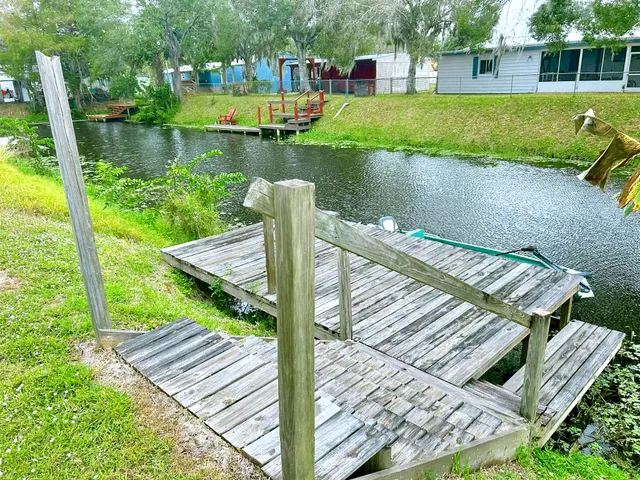 a view of a chair and tables in the garden