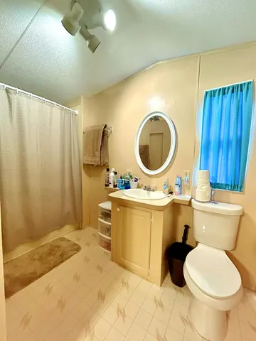 a bathroom with a toilet a sink and a bathtub