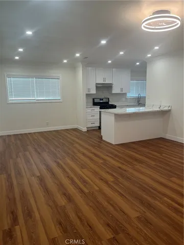 a view of kitchen view with wooden floor and kitchen