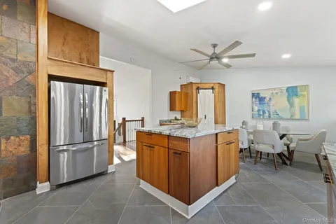 a kitchen with sink cabinets and stainless steel appliances