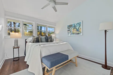 a bed room with a bed and a lamp