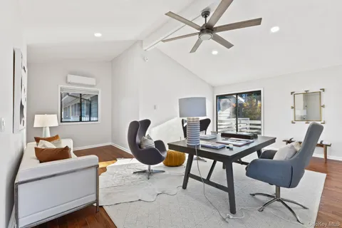 a workspace with furniture and a window