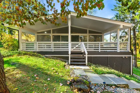 a view of the house with a yard