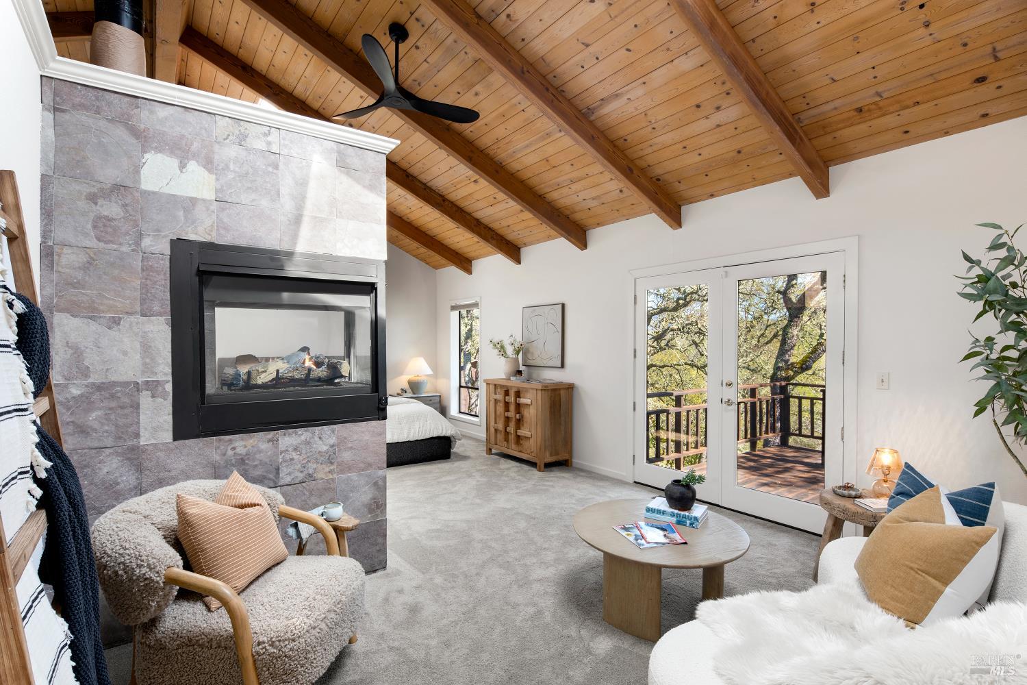 3460 Warm Springs Road Glen Ellen, CA 95442 - Photo 18 of 40 a living room with furniture and a fireplace
