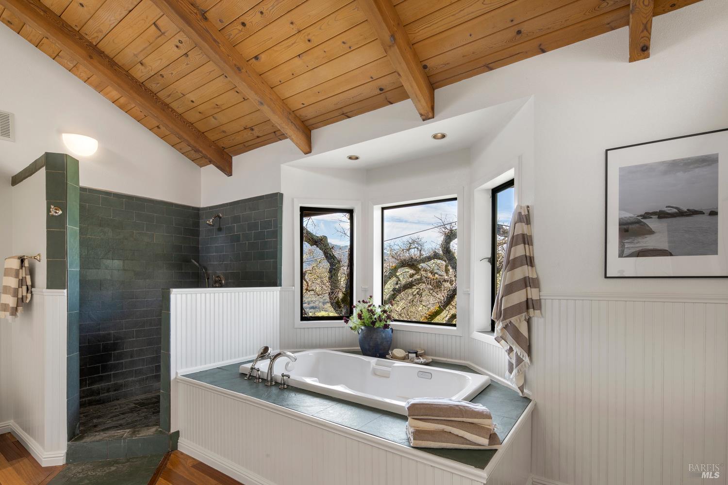 3460 Warm Springs Road Glen Ellen, CA 95442 - Photo 19 of 40 a bathroom with a granite countertop tub sink and mirror