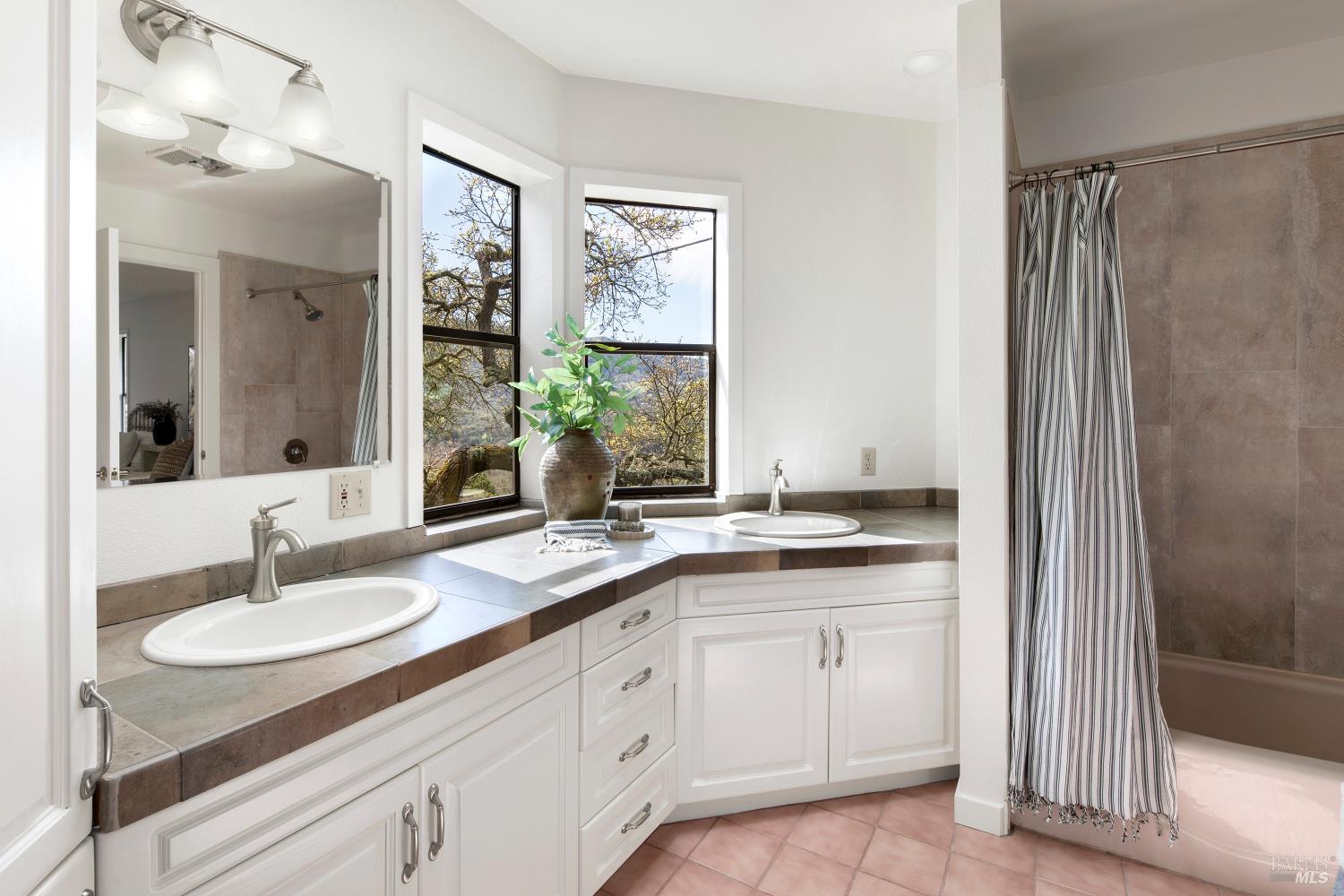 3460 Warm Springs Road Glen Ellen, CA 95442 - Photo 26 of 40 a bathroom with a granite countertop sink and a mirror
