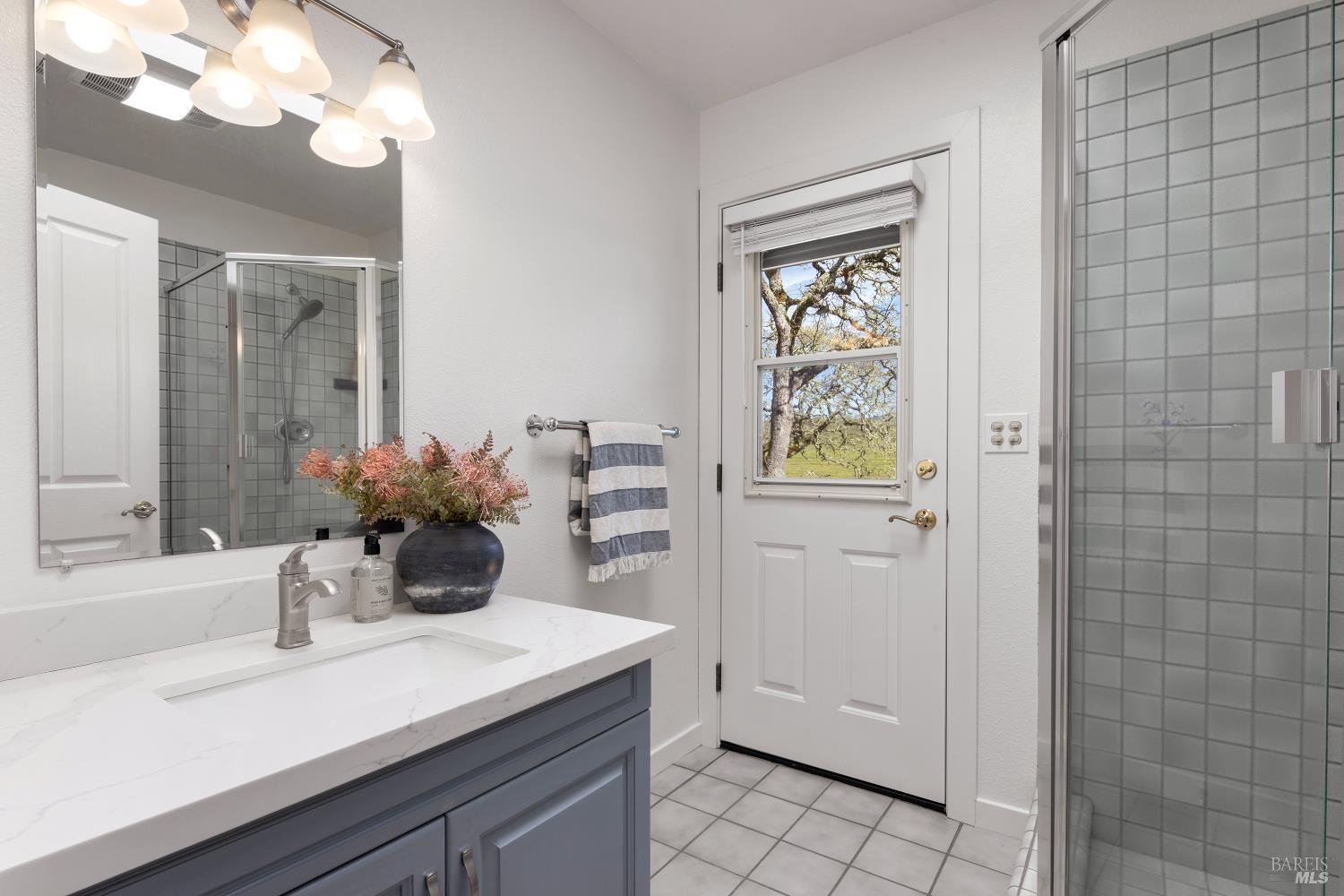 3460 Warm Springs Road Glen Ellen, CA 95442 - Photo 28 of 40 a bathroom with a sink a vanity and a mirror
