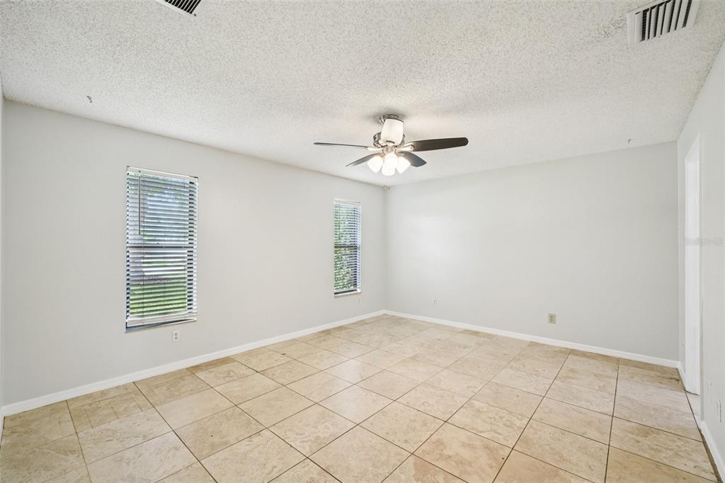 3109 Lake Valencia Lane East Palm Harbor, FL 34684 - Photo 18 of 59 a view of an empty room with a window