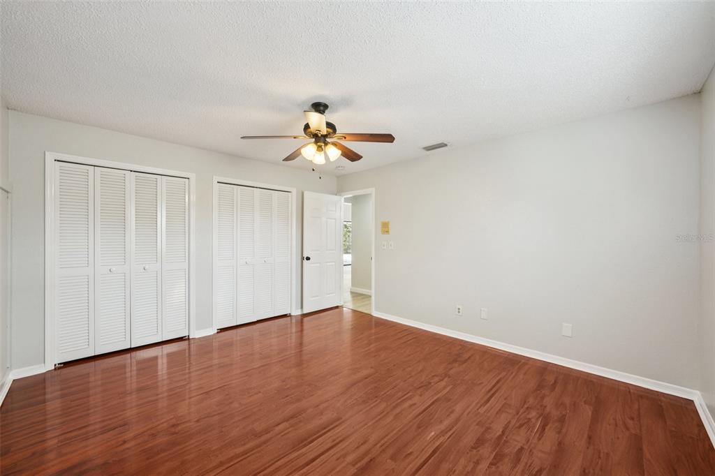 3109 Lake Valencia Lane East Palm Harbor, FL 34684 - Photo 22 of 59 a view of an empty room with wooden floor