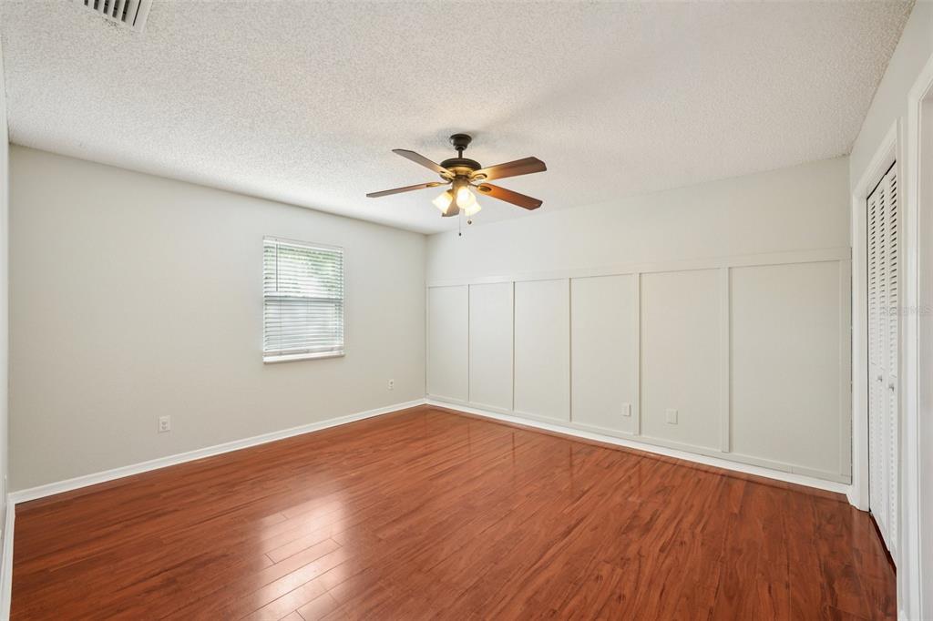 3109 Lake Valencia Lane East Palm Harbor, FL 34684 - Photo 23 of 59 wooden floor in an empty room with a window