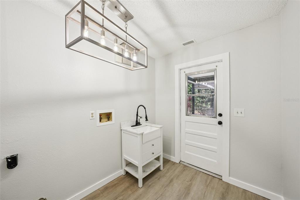 3109 Lake Valencia Lane East Palm Harbor, FL 34684 - Photo 28 of 59 a view of a storage & utility room with a window