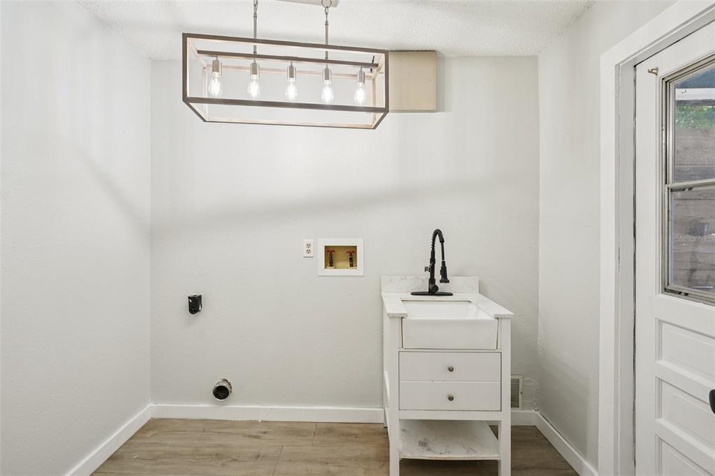 3109 Lake Valencia Lane East Palm Harbor, FL 34684 - Photo 29 of 59 a bathroom with a sink and a mirror
