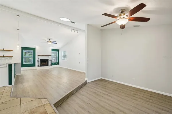 a view of a kitchen with a stove cabinets and wooden floor