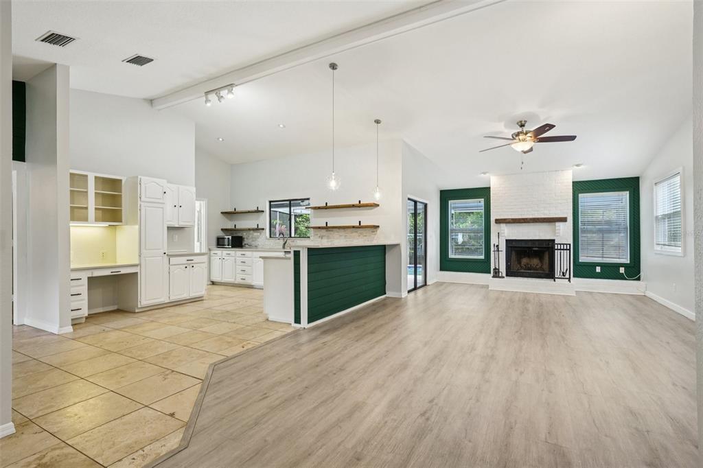3109 Lake Valencia Lane East Palm Harbor, FL 34684 - Photo 9 of 59 a view of a kitchen with a stove cabinets and wooden floor