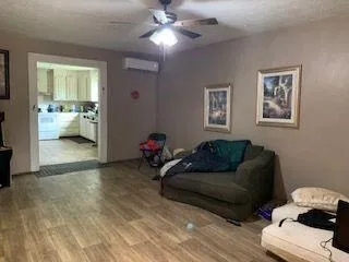 a living room with furniture and a mirror