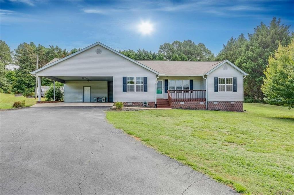 1200 Pleasant Hill Road Martin, GA 30557 - Photo 1 of 1 a front view of house with yard and green space