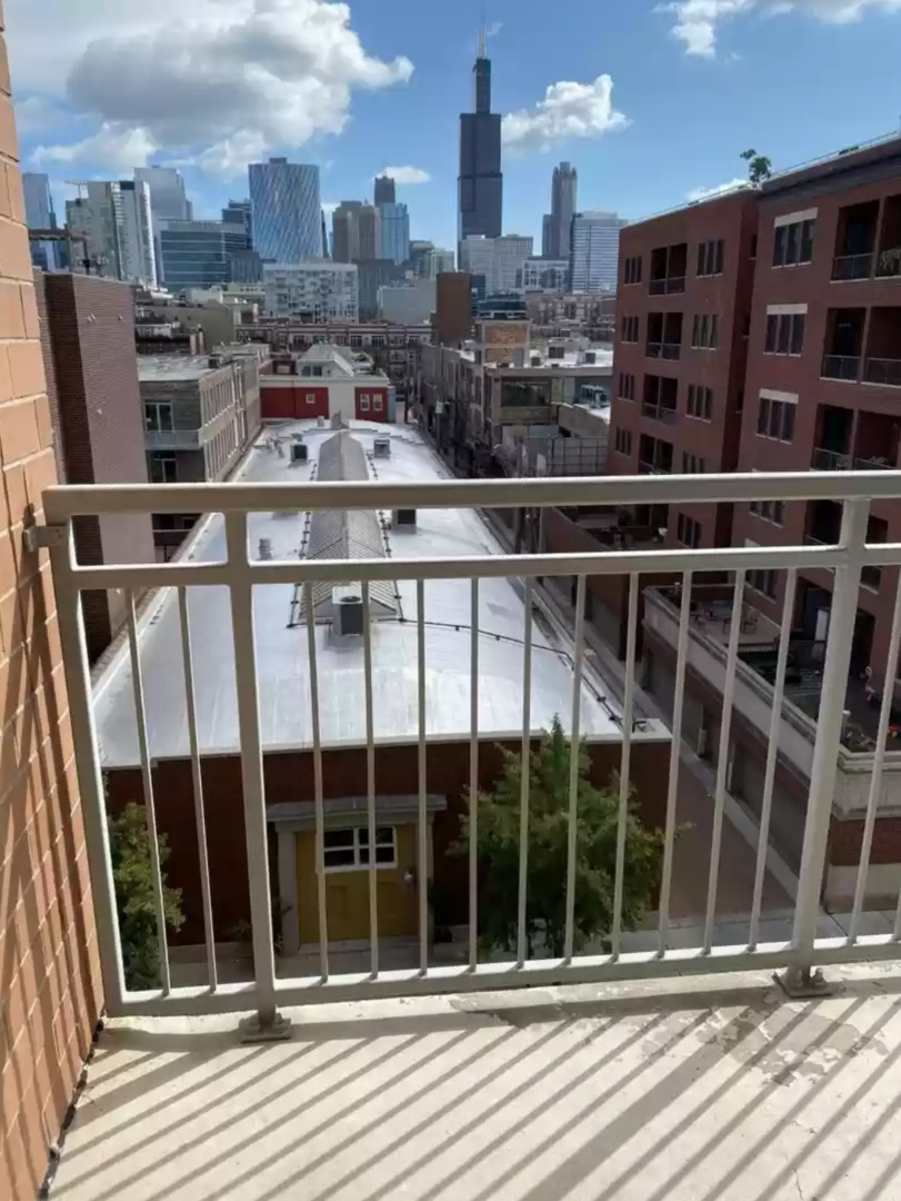 1200 West Monroe Street, Unit 603 Chicago, IL 60607 - Photo 11 of 11 a view of a balcony with a floor to ceiling window