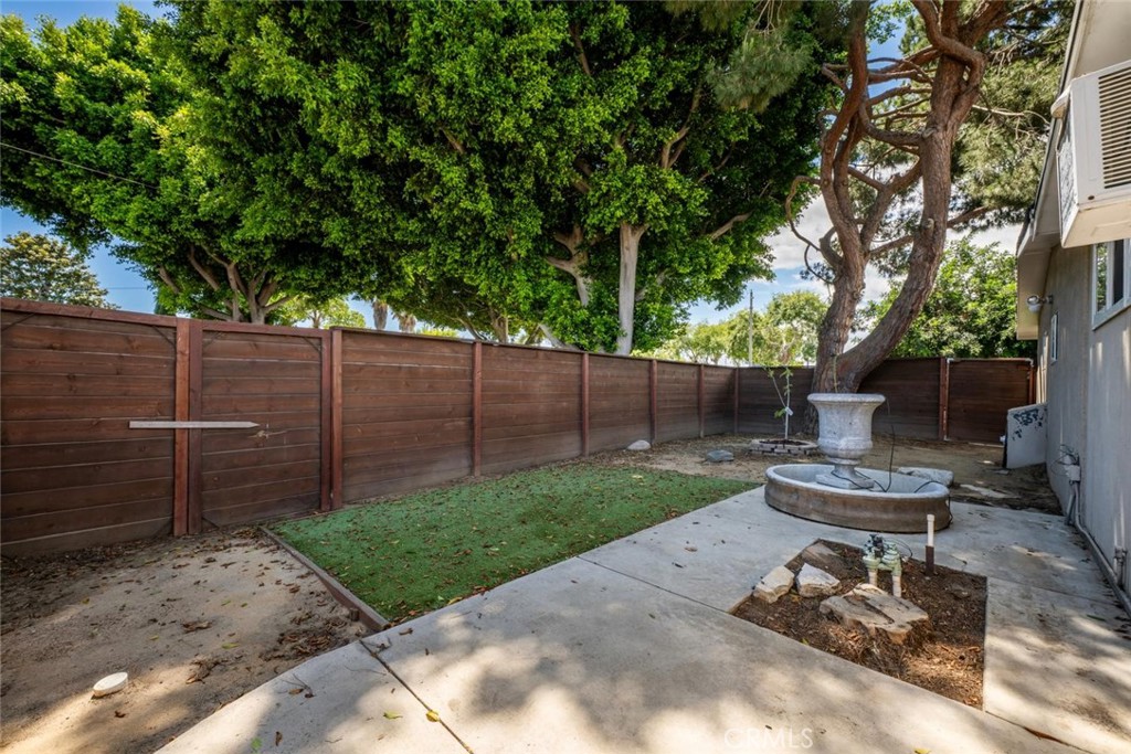1238 North Studebaker Road Long Beach, CA 90815 - Photo 41 of 47 a view of a backyard with chair and a table and chair