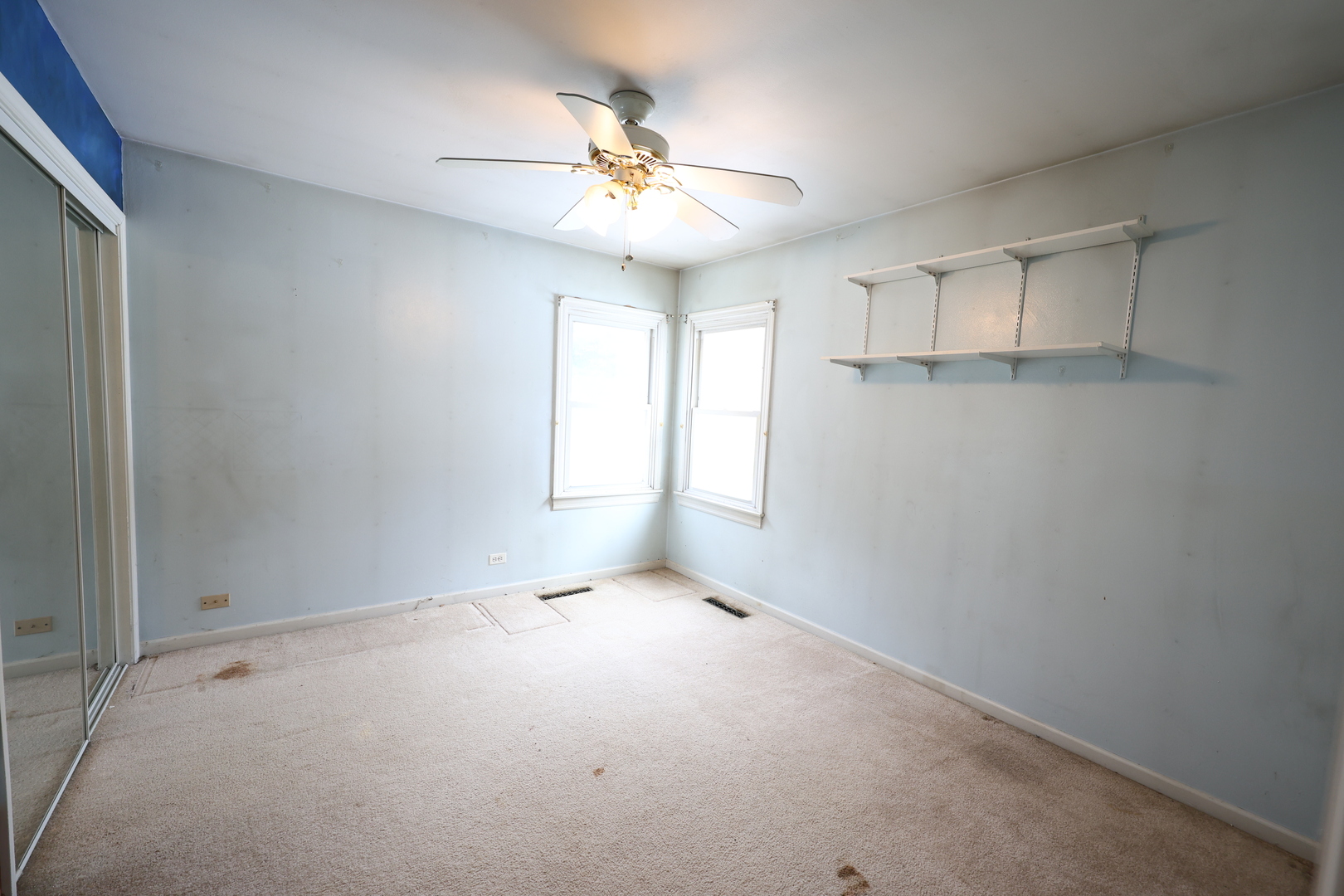 6837 113th Street Worth, IL 60482 - Photo 11 of 17 an empty room with windows and fan