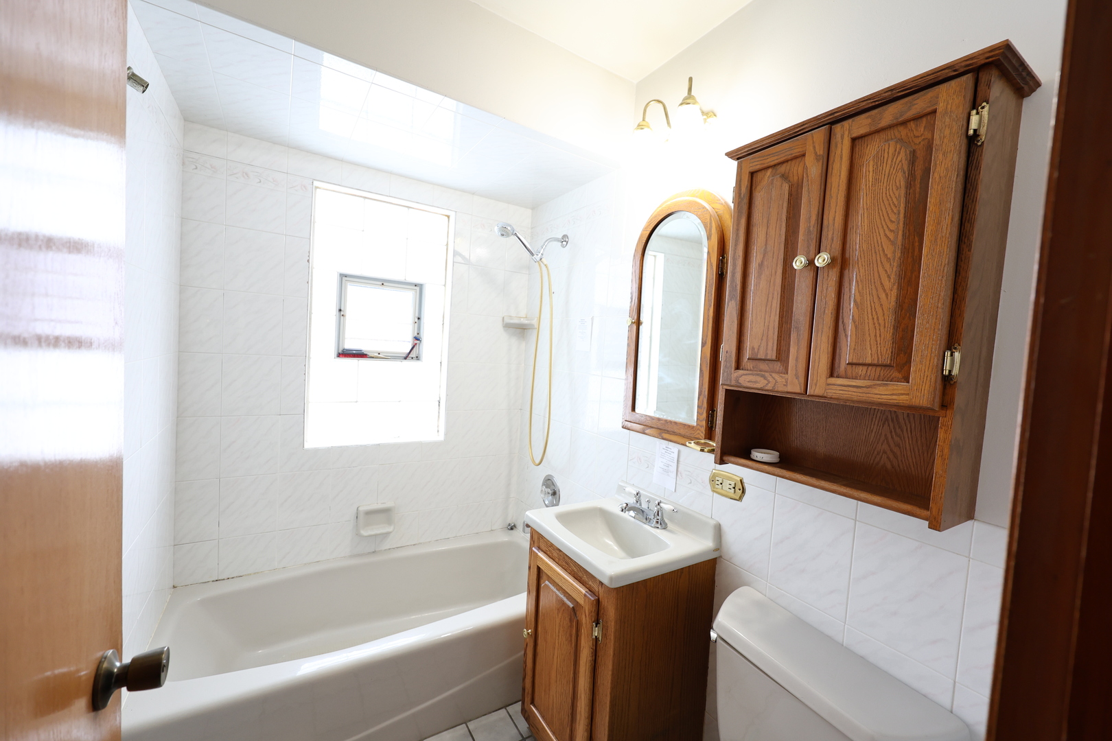 6837 113th Street Worth, IL 60482 - Photo 12 of 17 a bathroom with a sink and a mirror