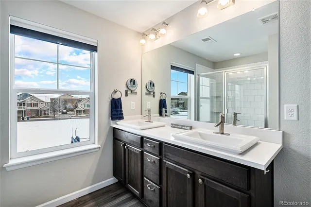 a bathroom with a sink and a large mirror