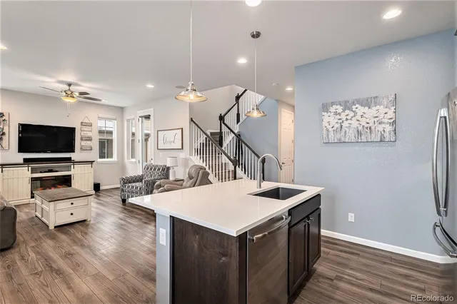 a view of living room kitchen with furniture and flat screen tv