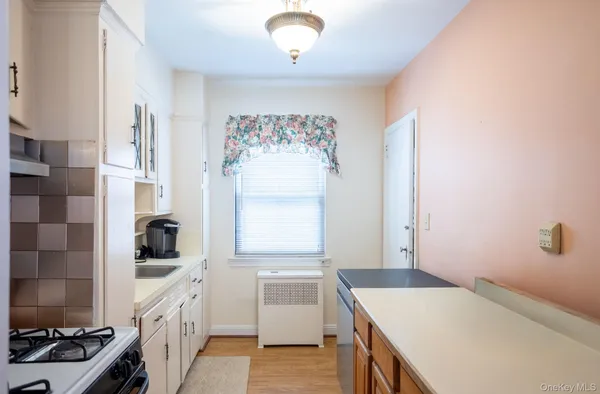 a kitchen that has a sink and a stove
