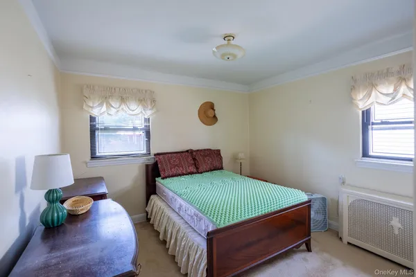 a bedroom with furniture and a gym equipment