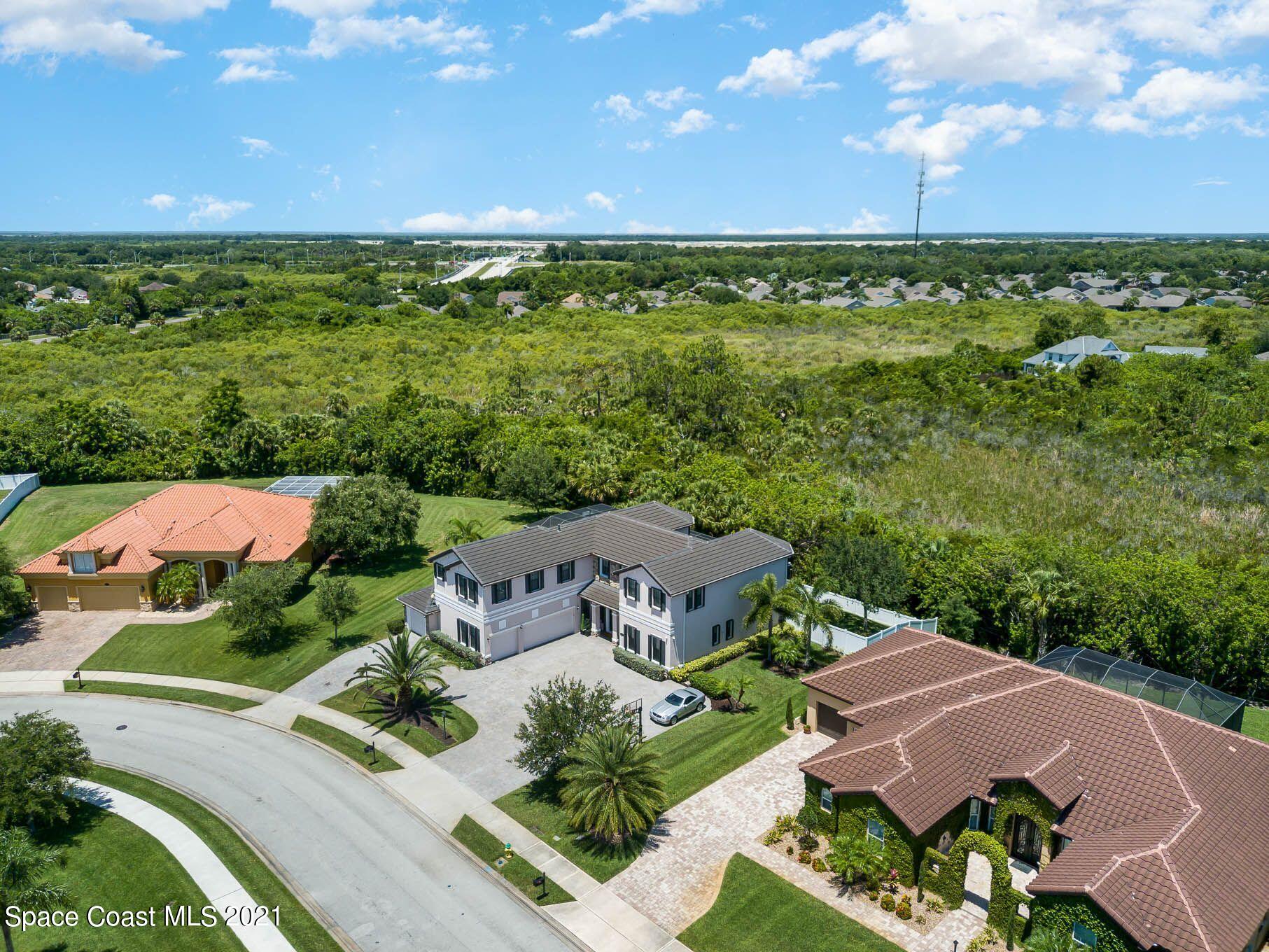 4175 Waterloo Place Melbourne, FL 32940 - Photo 11 of 49 an aerial view of a house with a yard