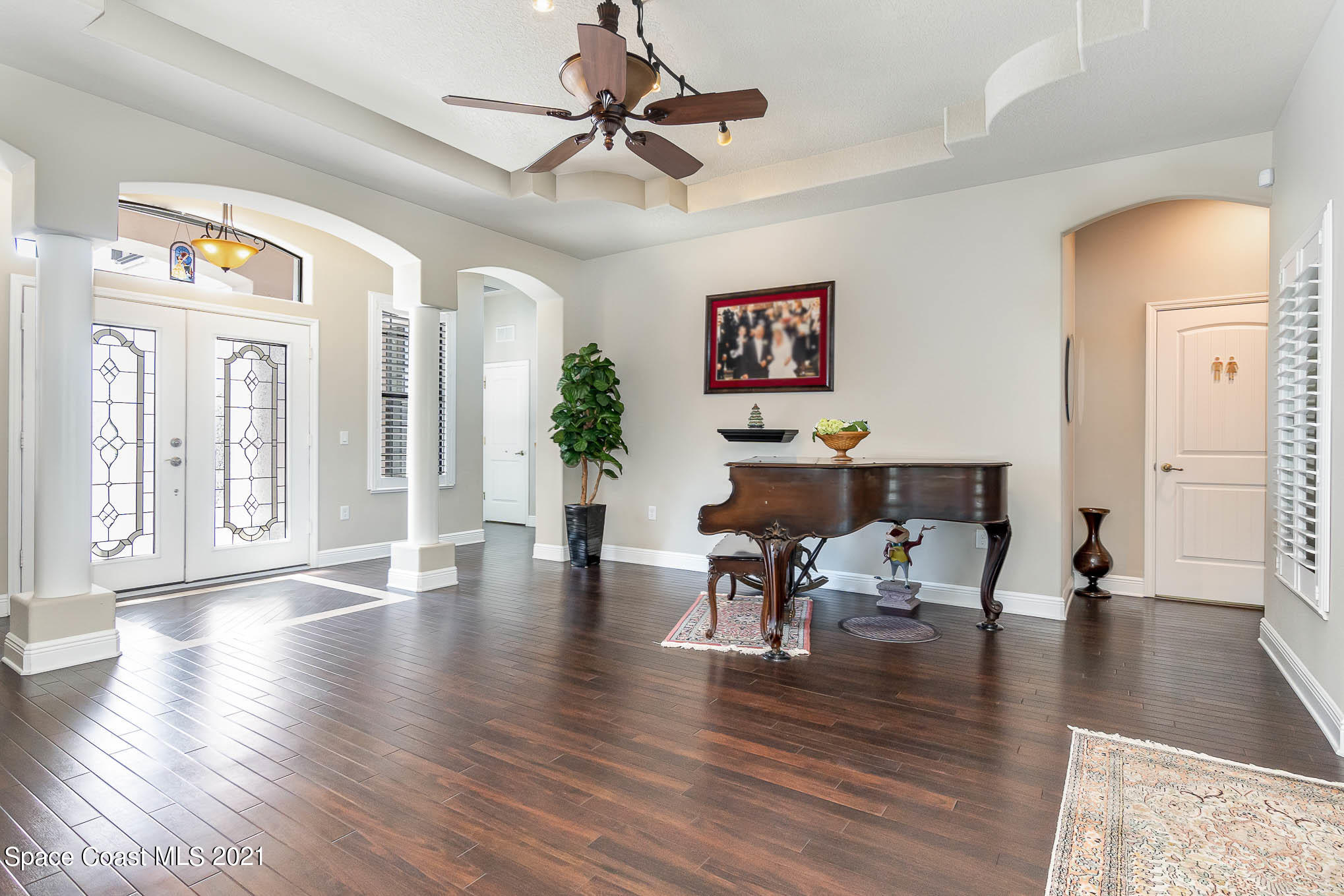 4175 Waterloo Place Melbourne, FL 32940 - Photo 12 of 49 a living room with furniture and wooden floor