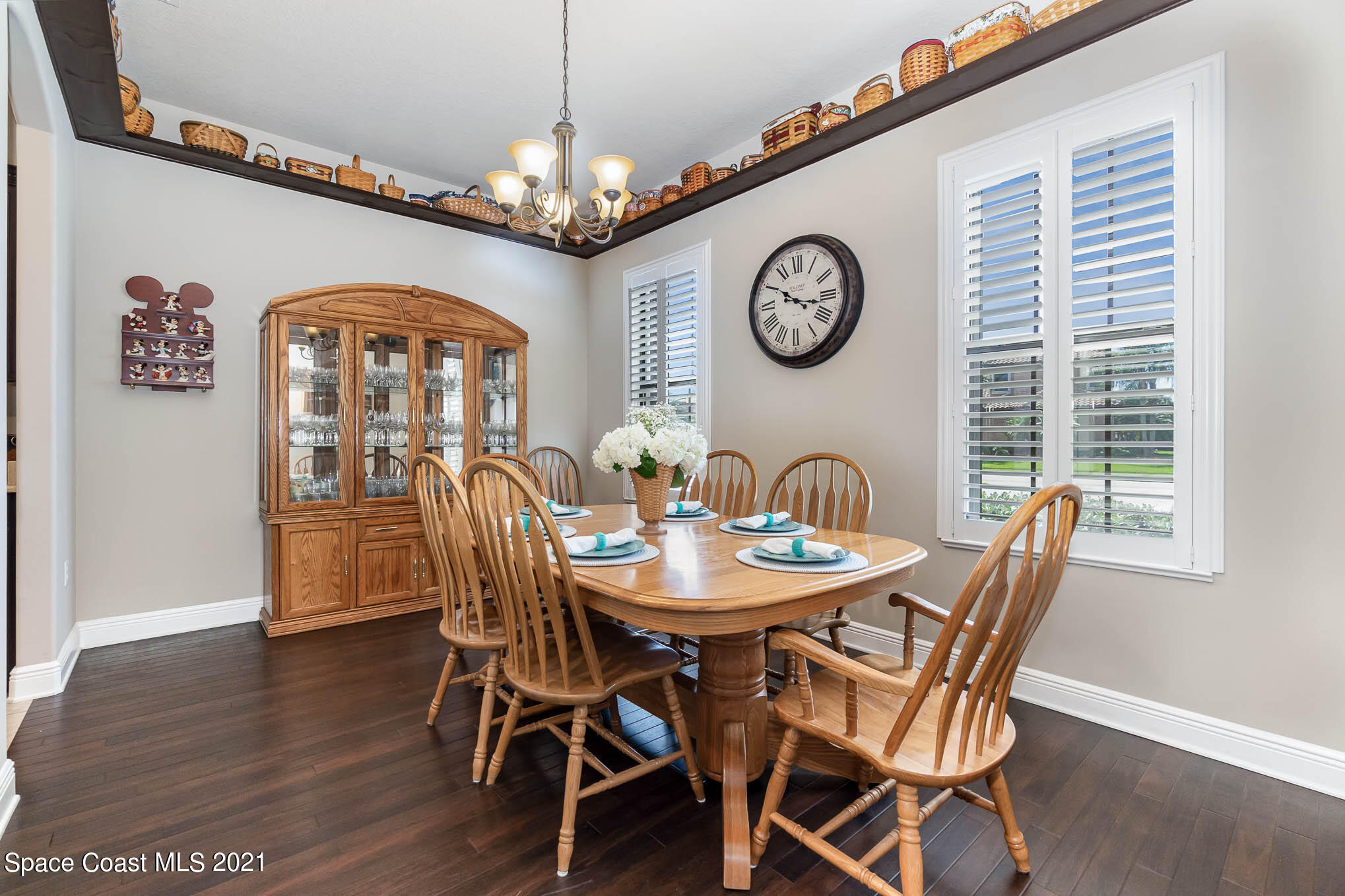 4175 Waterloo Place Melbourne, FL 32940 - Photo 14 of 49 a view of a dining room with furniture a chandelier and wooden floor