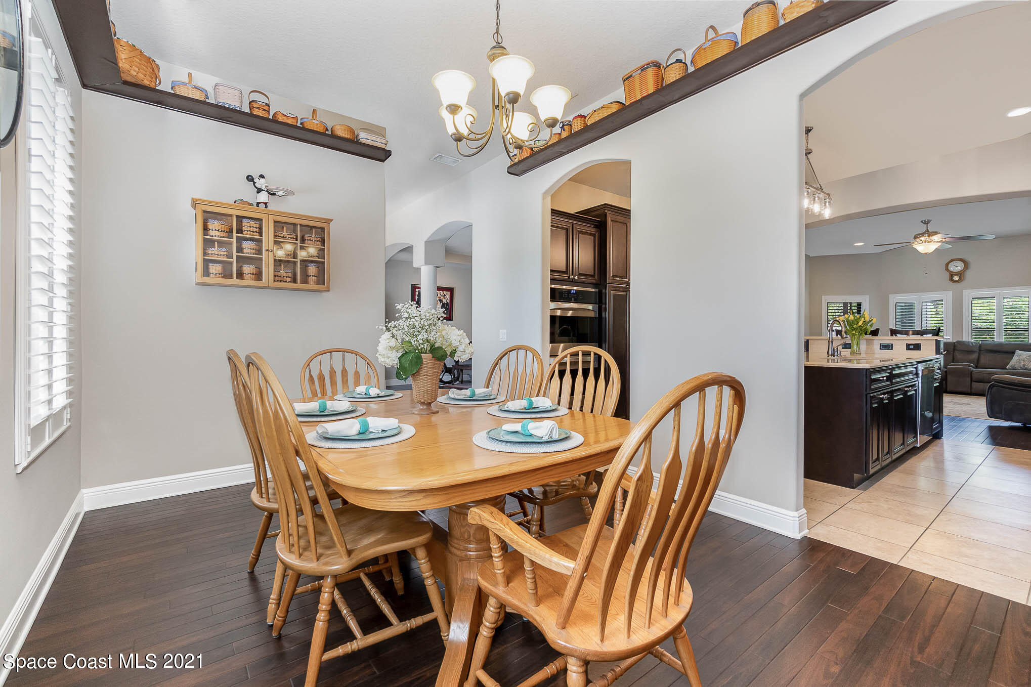 4175 Waterloo Place Melbourne, FL 32940 - Photo 15 of 49 a view of a dining room with furniture and wooden floor