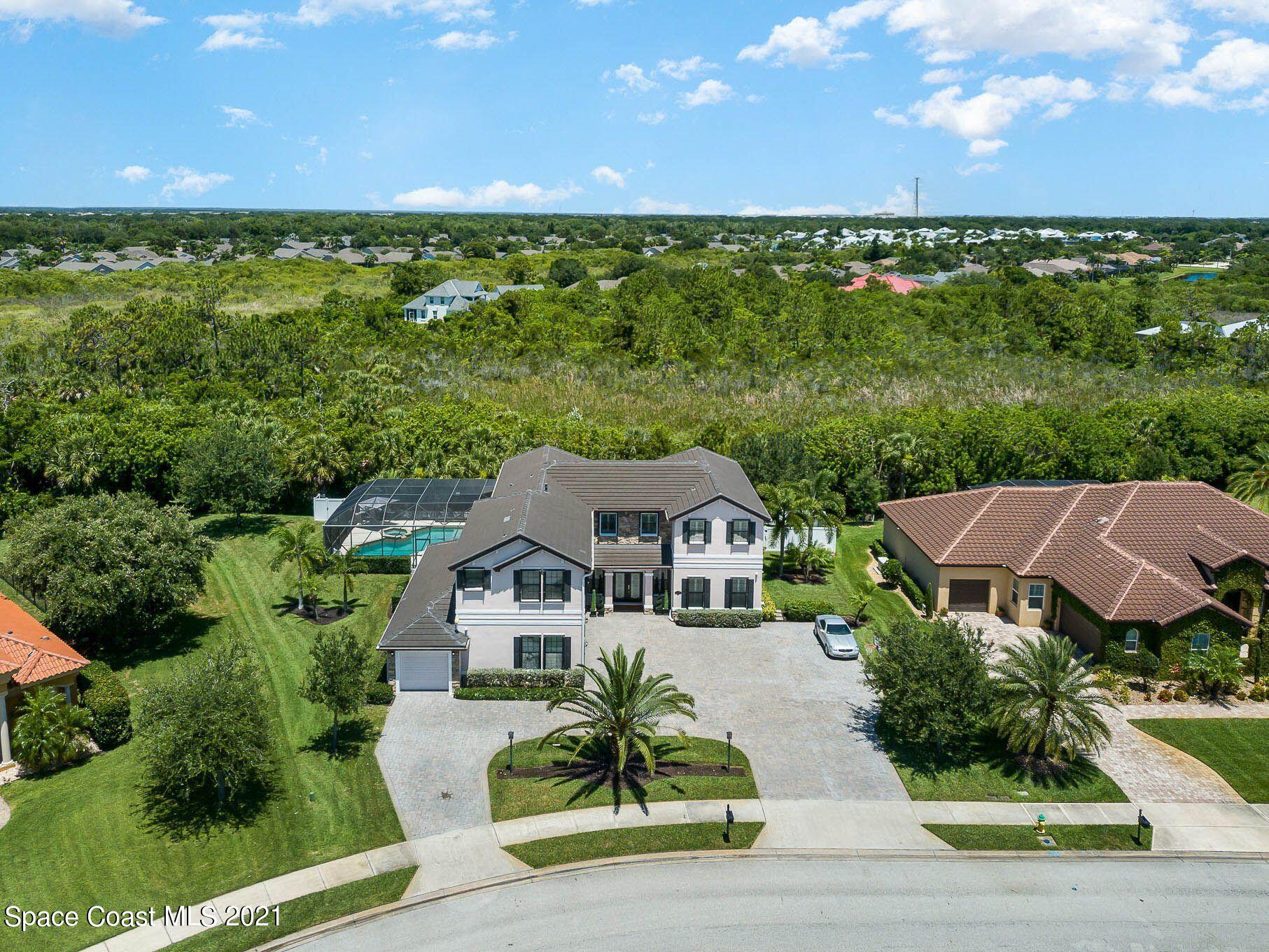 4175 Waterloo Place Melbourne, FL 32940 - Photo 3 of 49 an aerial view of a house